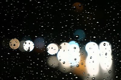 Close-up of illuminated lights at night