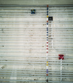 Full frame shot of metal hanging on wall