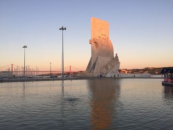 Scenic view of building against sky during sunset