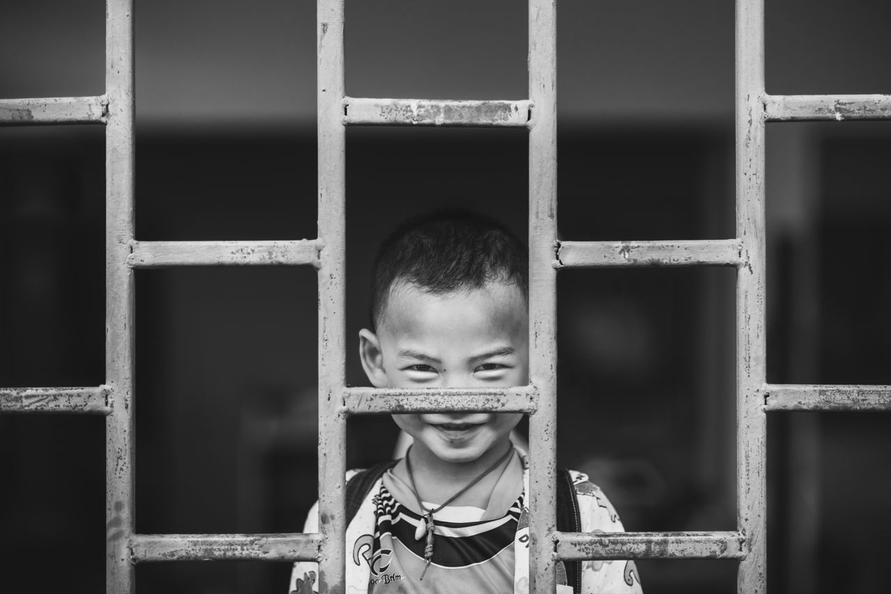 childhood, child, boys, males, portrait, one person, headshot, men, real people, metal, front view, looking, lifestyles, leisure activity, innocence, emotion, casual clothing, outdoors