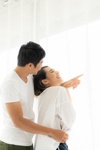 Young couple looking at camera