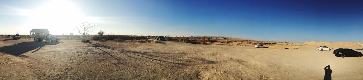 View of desert against clear blue sky