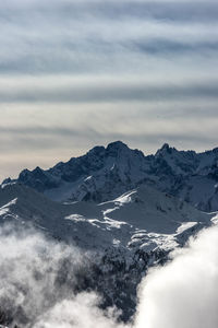 Scenic view of snowcapped mountains against sky