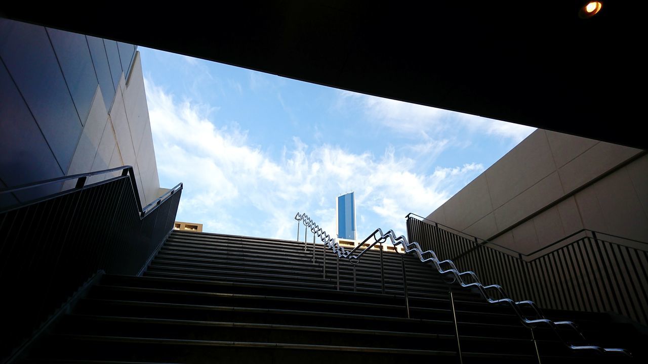 staircase, steps and staircases, steps, low angle view, railing, architecture, built structure, sky, day, building exterior, no people, hand rail, outdoors