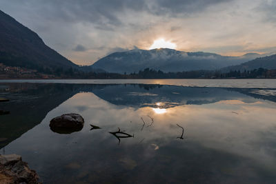 Scenic view of lake against sky during sunset