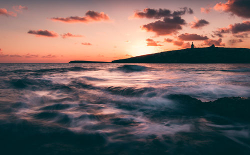 Scenic view of sea against sky during sunset