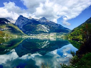 Scenic view of lake and mountains against sky