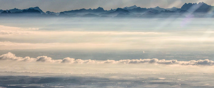 Aerial view of mountains against sky during sunset