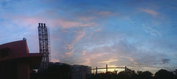 Low angle view of built structure against cloudy sky