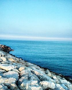 Scenic view of sea against blue sky