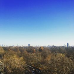 Cityscape against clear blue sky