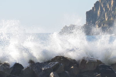 Waves splashing on rocks