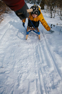 Man with umbrella on snowy mountain