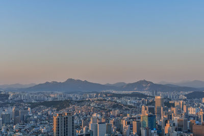 Aerial view of city at sunset