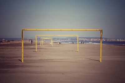 Scenic view of beach against clear sky