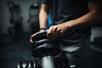 Close-up image of attractive young athlete getting ready for training.