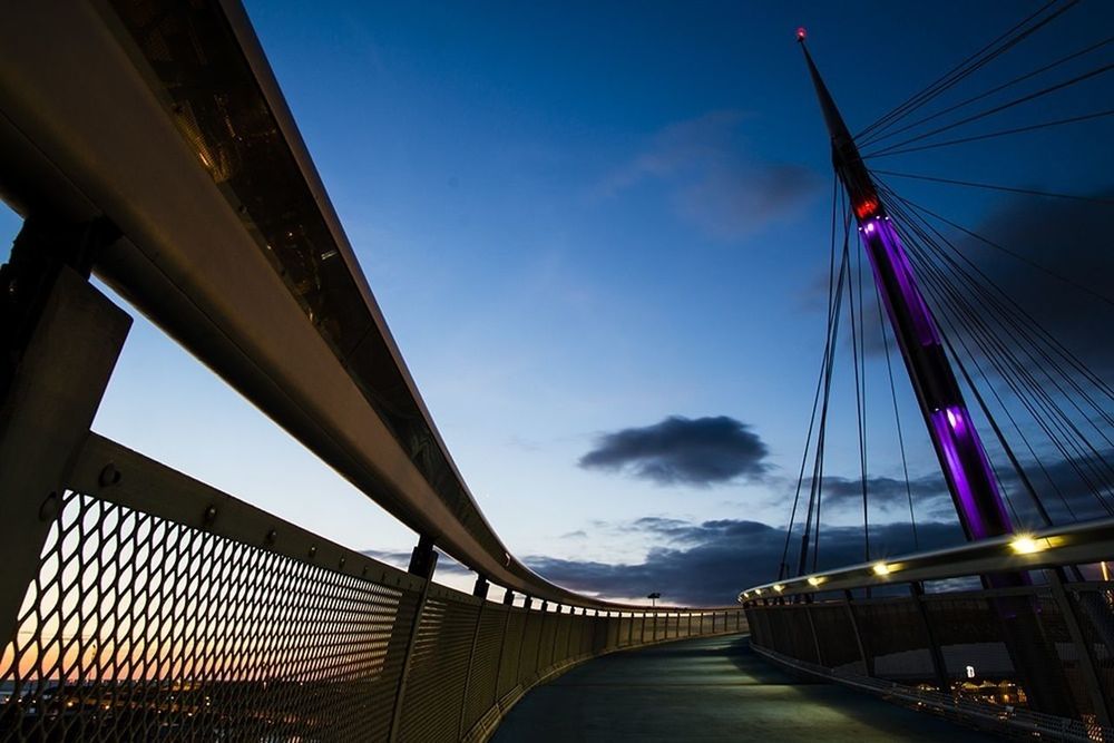 BRIDGE AGAINST BLUE SKY IN CITY