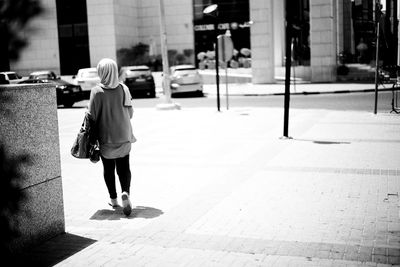 Full length of woman standing in city