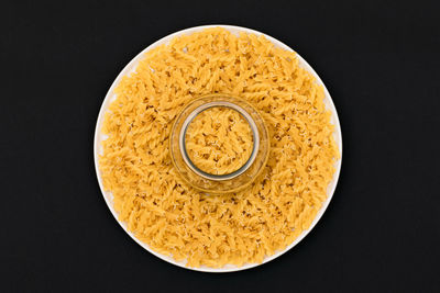 Directly above shot of bread against black background