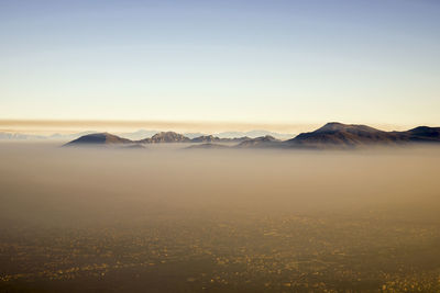 Scenic view of snowcapped mountains against clear sky