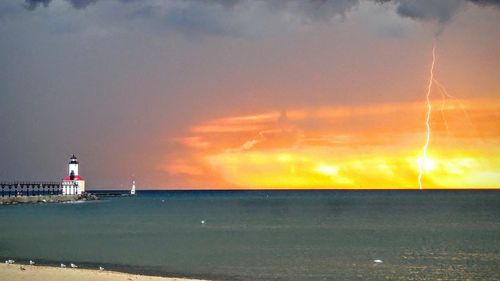 Scenic view of sea against sky during sunset