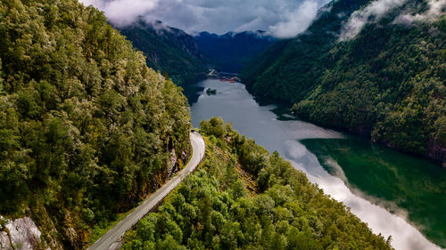 High angle view of road amidst trees and mountains