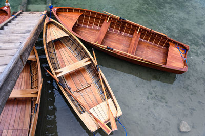 Dolomites. braies lake and boats. emerald colors on the water.