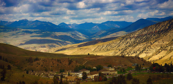 Scenic view of landscape and mountains against sky