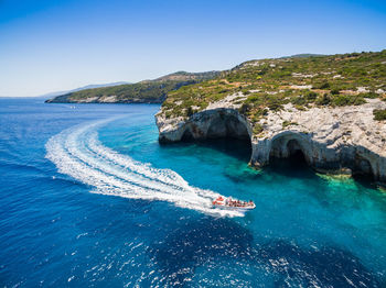 Scenic view of sea against clear blue sky