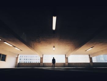 Silhouette man in building