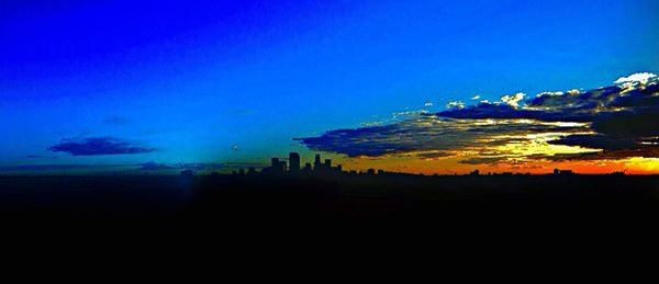 Scenic view of landscape against sky at sunset