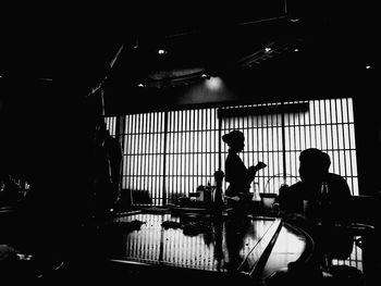Silhouette people working in office