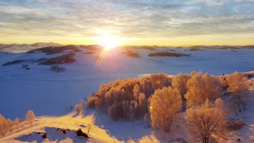 Scenic view of snow covered landscape against sky