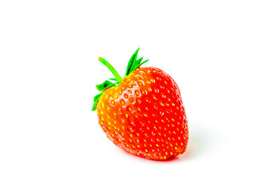 Close-up of strawberry over white background