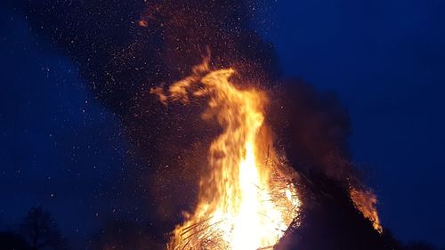 Low angle view of bonfire against sky at night