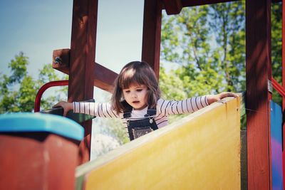 Portrait of happy girl playing on playground