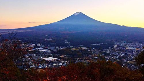 Scenic view of mountains against sky at sunset
