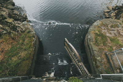 High angle view of waterfall by river