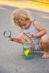 Portrait of boy playing with toy car