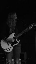 Man playing guitar at music concert