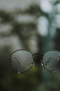 Close-up of water drops on sunglasses