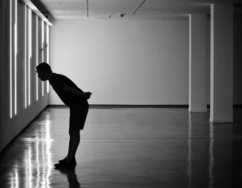 Woman standing in the dark