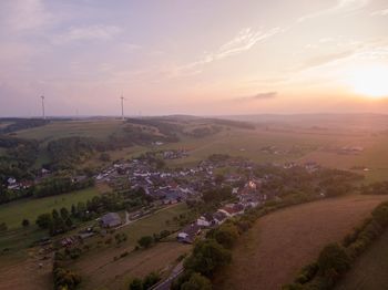 Aerial view of landscape against sky during sunset