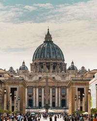 Group of people in cathedral against sky