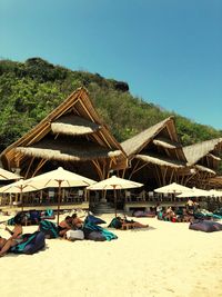 Panoramic view of beach against clear blue sky