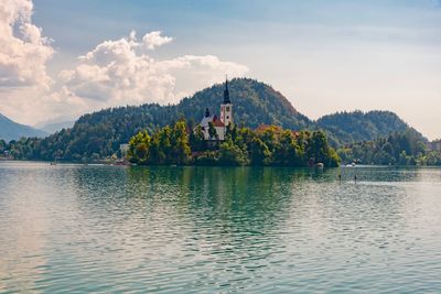 Scenic view of lake and mountains against sky