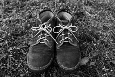 High angle view of shoes on field