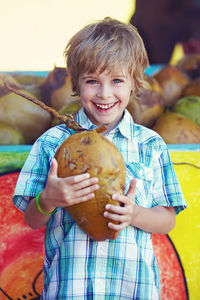 Portrait of smiling boy holding ice cream