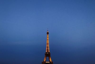 Low angle view of tower against blue sky