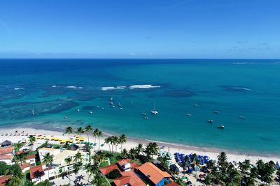 High angle view of sea and buildings against sky